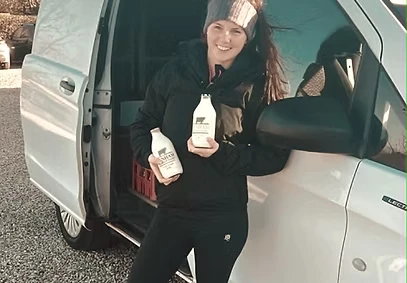 Annie beside the milk delivery van